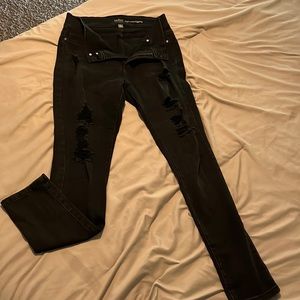 Distressed black skinny jeans